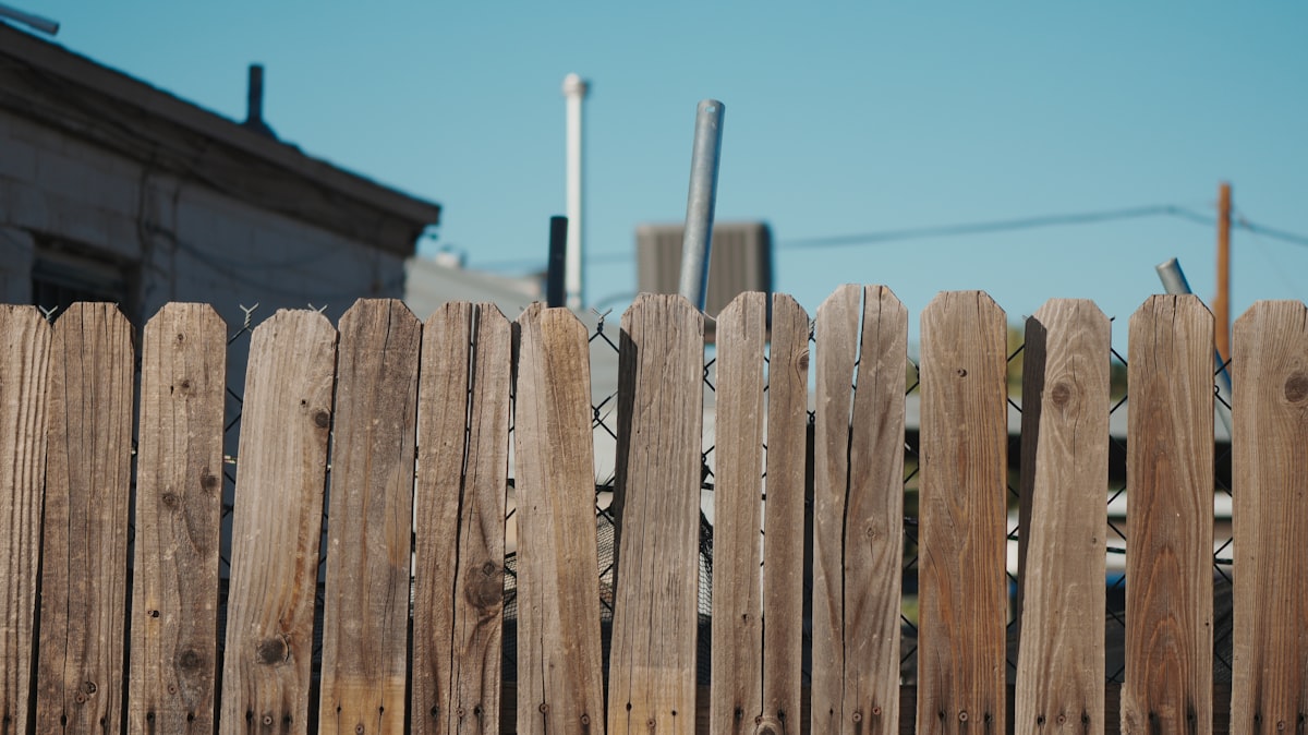 New wood fence installed around a home's backyard
