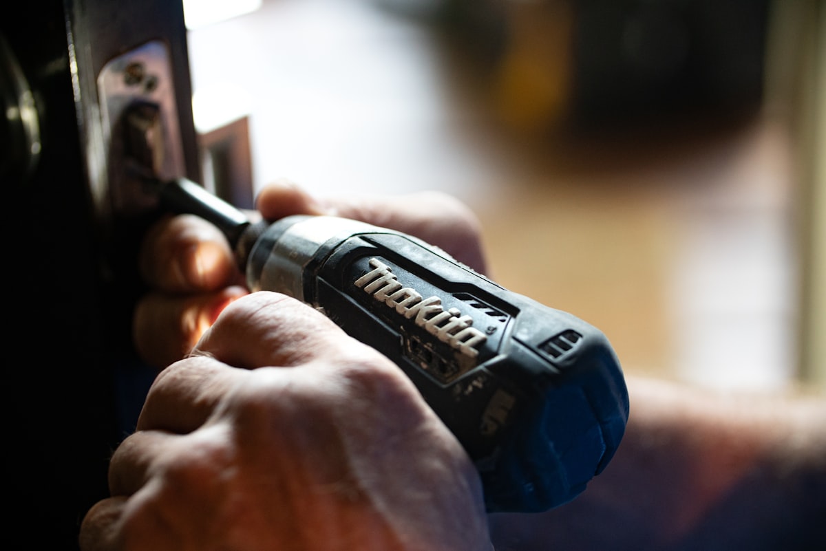 Handyman using a power drill on a home repair project