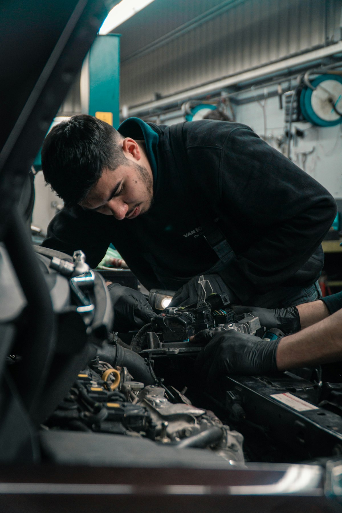 Mechanic working on a car engine